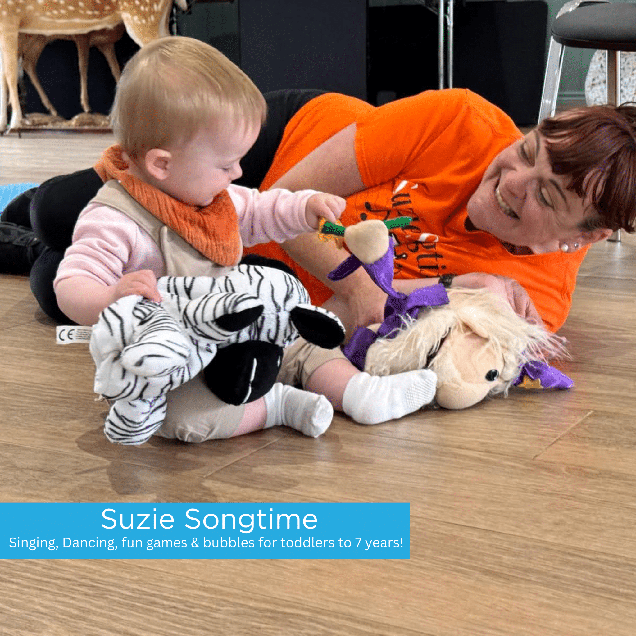 Suzie Playing with Baby on the floor during her song and dance session